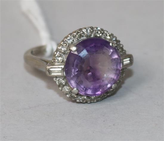A 1920s/1930s 18ct gold and platinum, amethyst and diamond dress ring, size K.